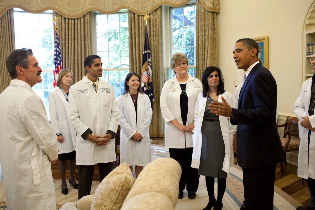 a diverse group of doctors meeting president obama